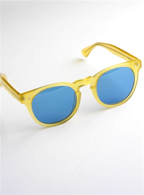 semi-round sunglasses in yellow with blue lenses